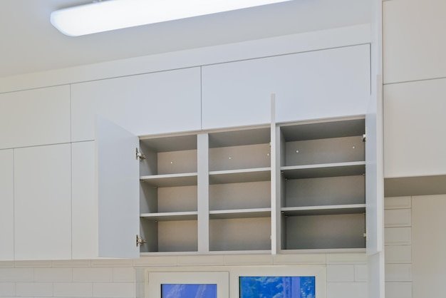 Bathroom cabinets with custom vanities and built-in shelving in a modern layout